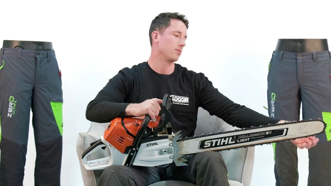 Phil holds the chain on top of the bar to show how snug a chainsaw chain should sit